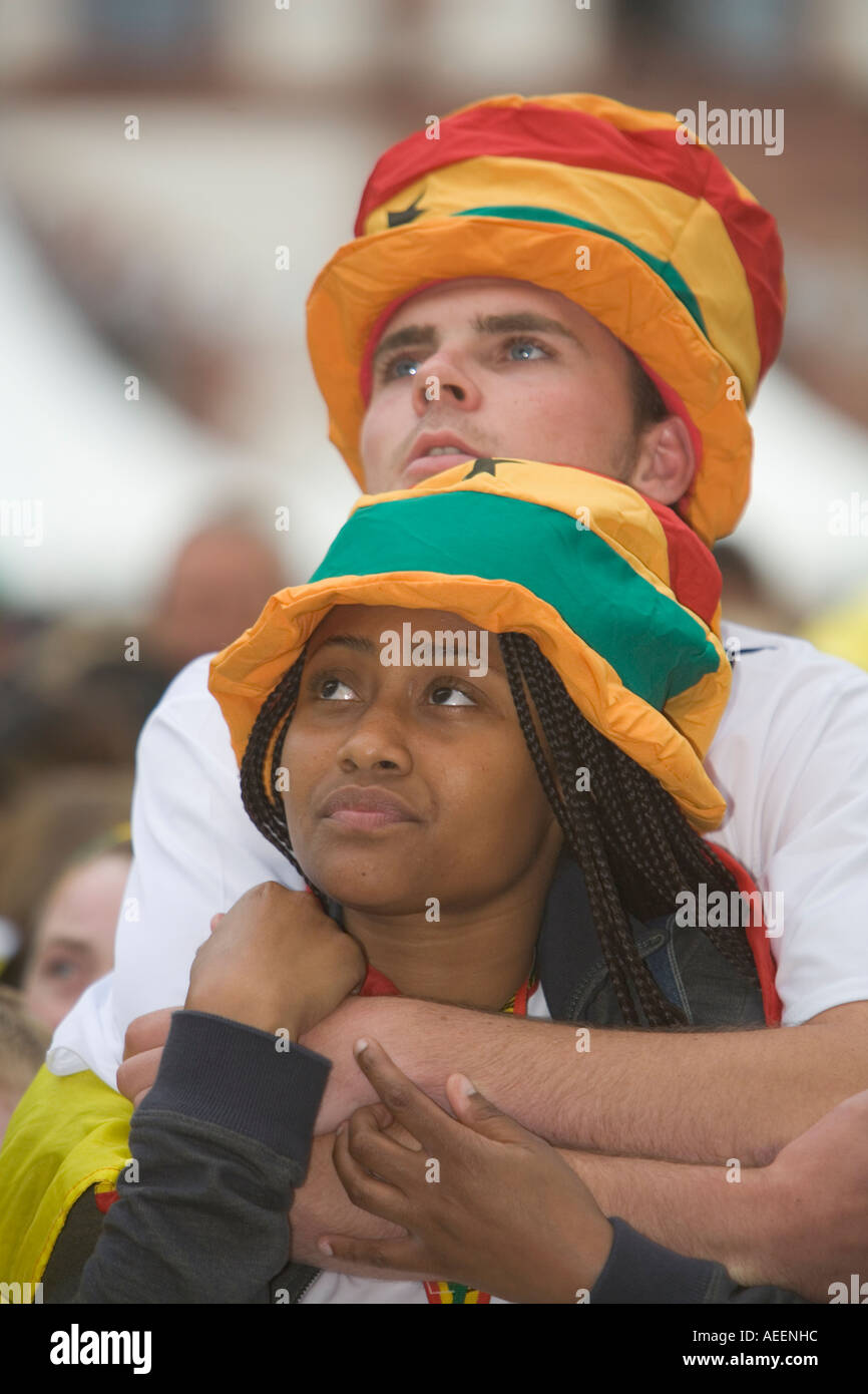 Two Ghanaian football fans viewing a world cup match with sad faces due to the defeat of the Ghanaian team Stock Photo
