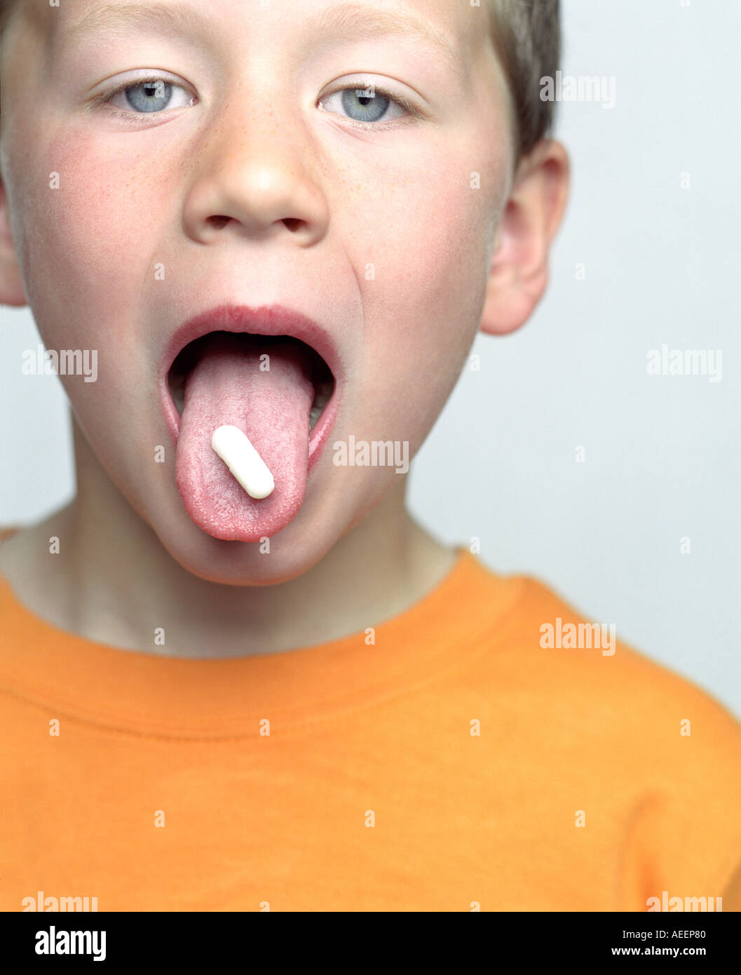 open mouth tongue little little boy with mouth open and pill on his tongue Stock Photo - Alamy