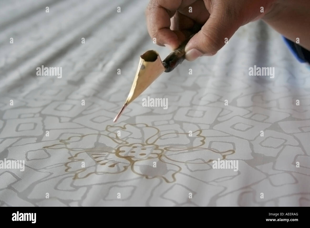 An artist drawing a traditional malay batik motif Stock Photo