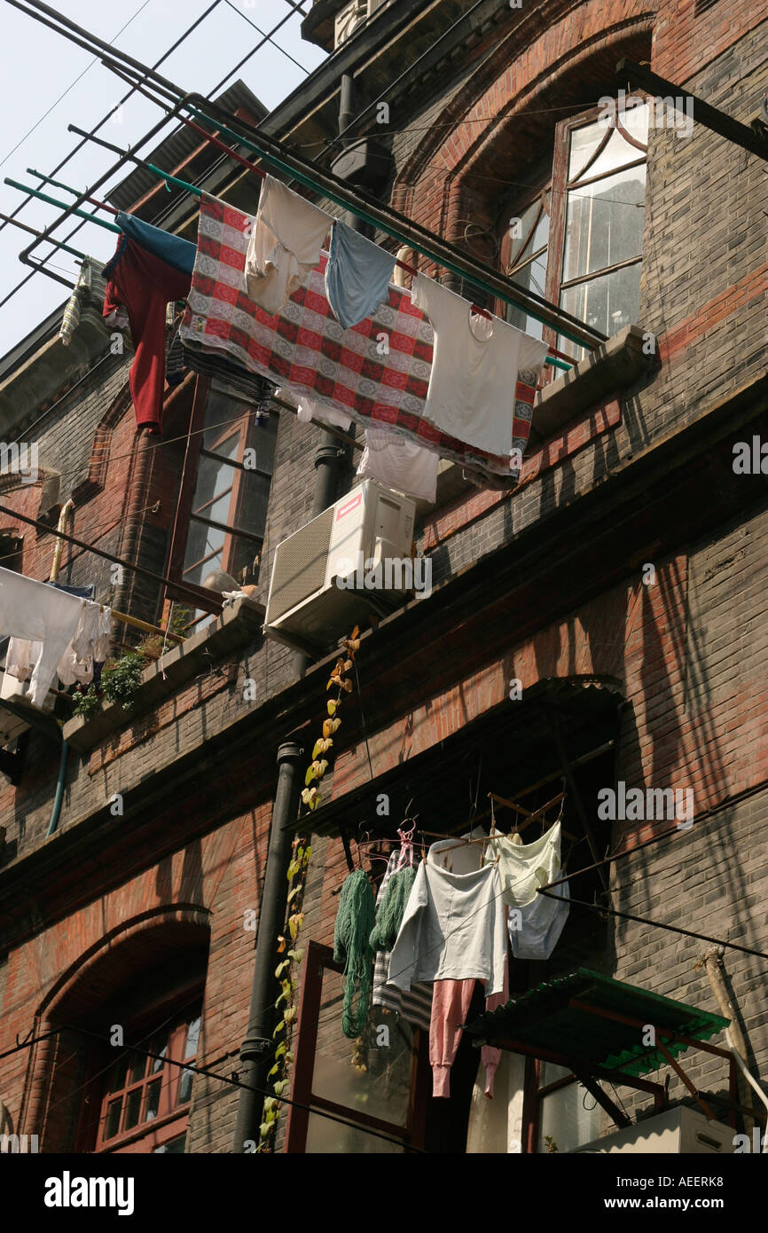 Washed clothes hanging out to dry in Shanghai's old town Stock Photo