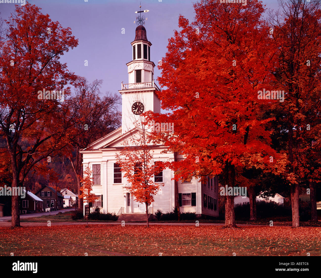 Chelsea in Vermont showing village church surrounded by flaming red ...