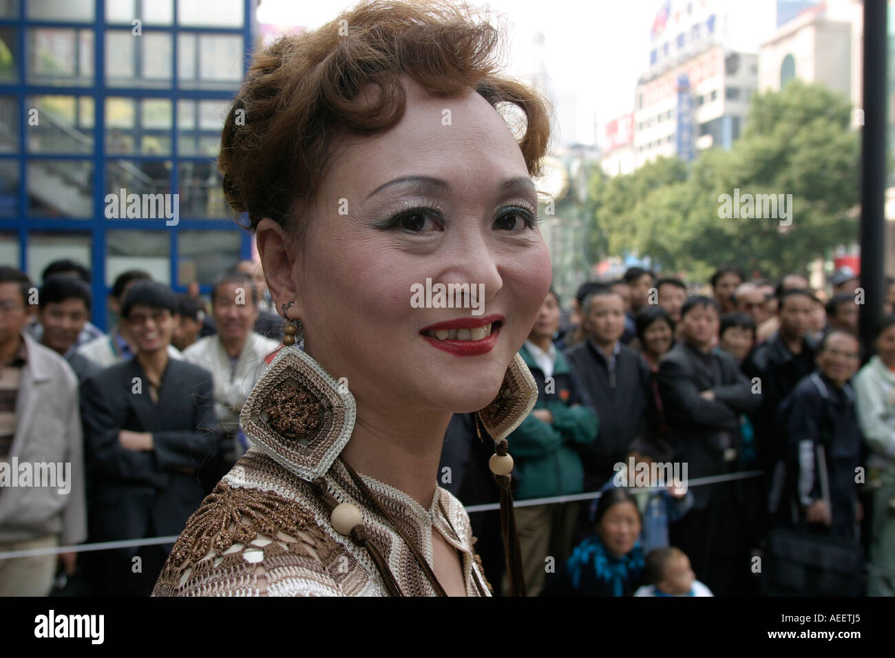 Shanghai China Amateur performer waits to take part in dance display on the open air stage in the Nanjing Road Stock Photo