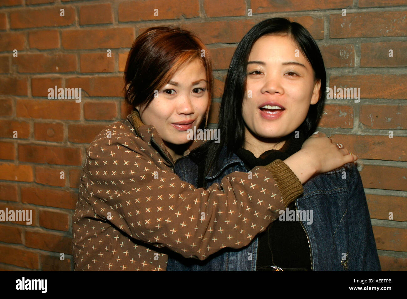 Young women, a little drunk, on the street outside one of the lively bars  on the Maoming Road, Shanghai Stock Photo - Alamy