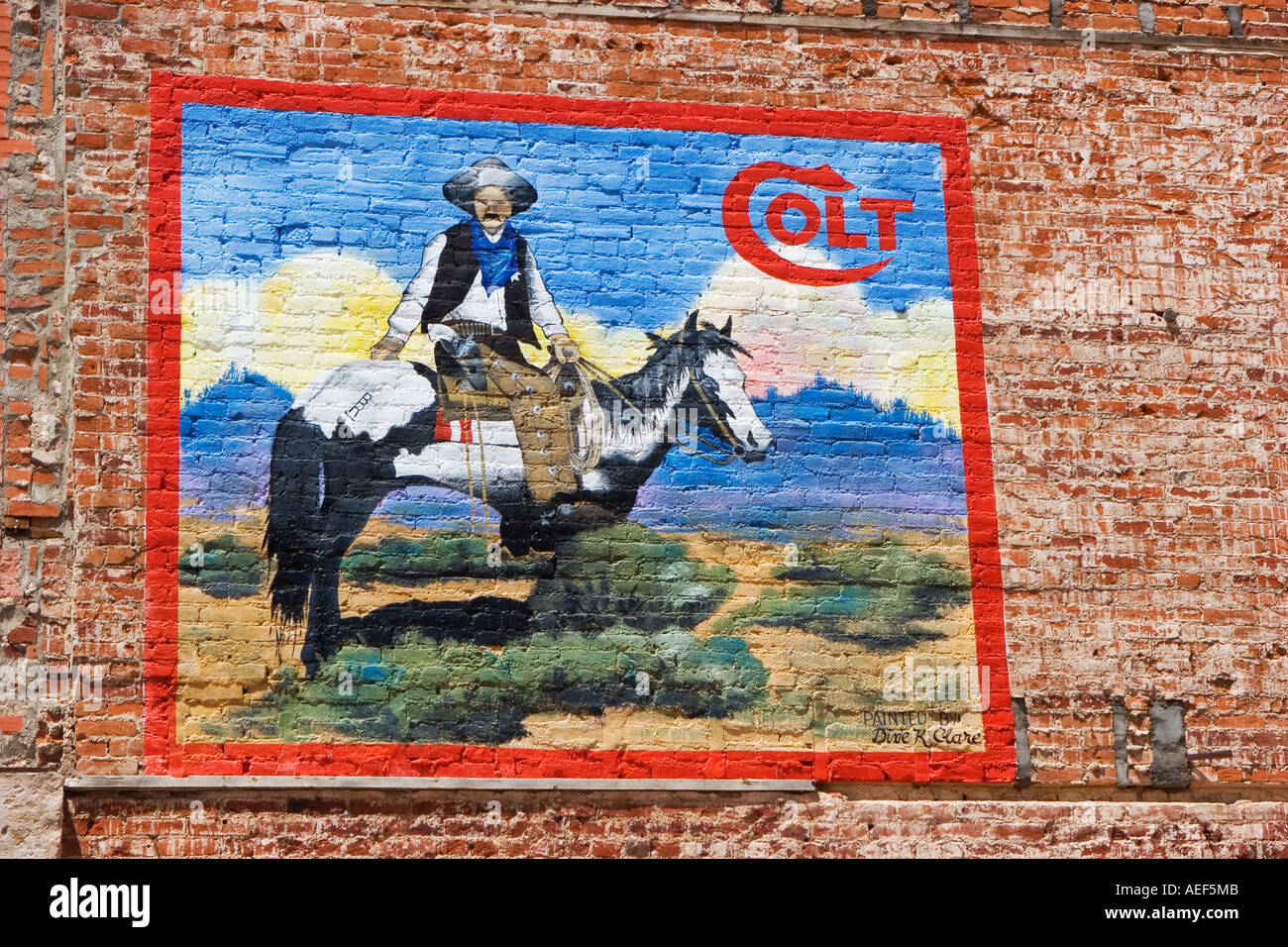 Painting of a cowboy wearing a Colt gun in Cripple Creek Colorado USA June 2006 Stock Photo