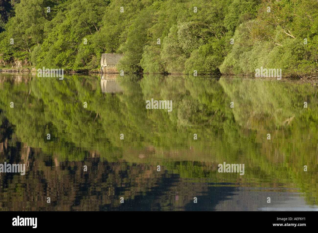 Boat House Reflections on Llyn Dinas near Beddgelert Snowdonia North West Wales Stock Photo
