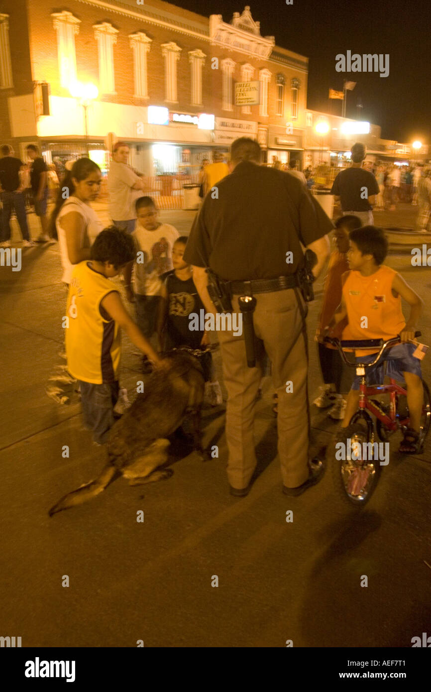 Children with police dog late at night during street dance Saline County Sheriff s Office, USA. Stock Photo