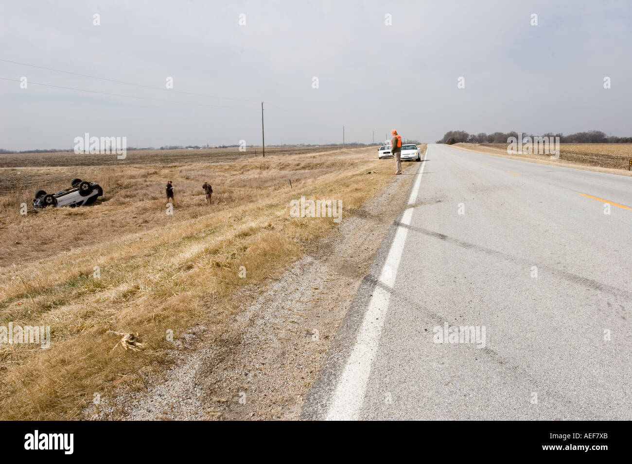 Traffic accident High winds made the driver of the SUV lose control of the vehicle. Deputy Sheriff's investigating. Stock Photo