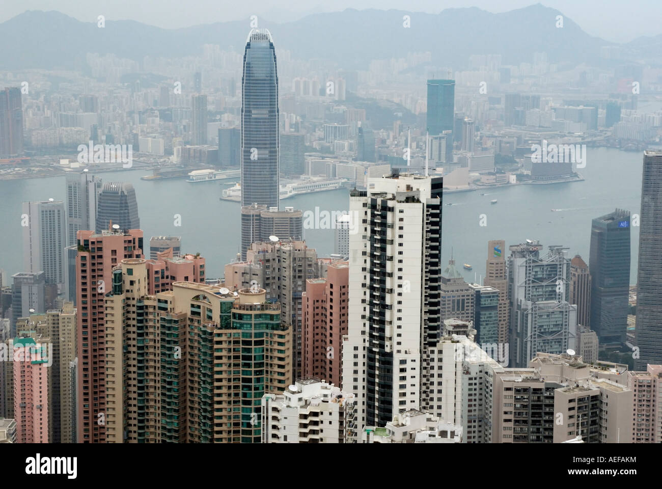 Hong Kong the harbour and Kowloon from 400 meter meters high. The view is often very bad due to the pollution. Stock Photo