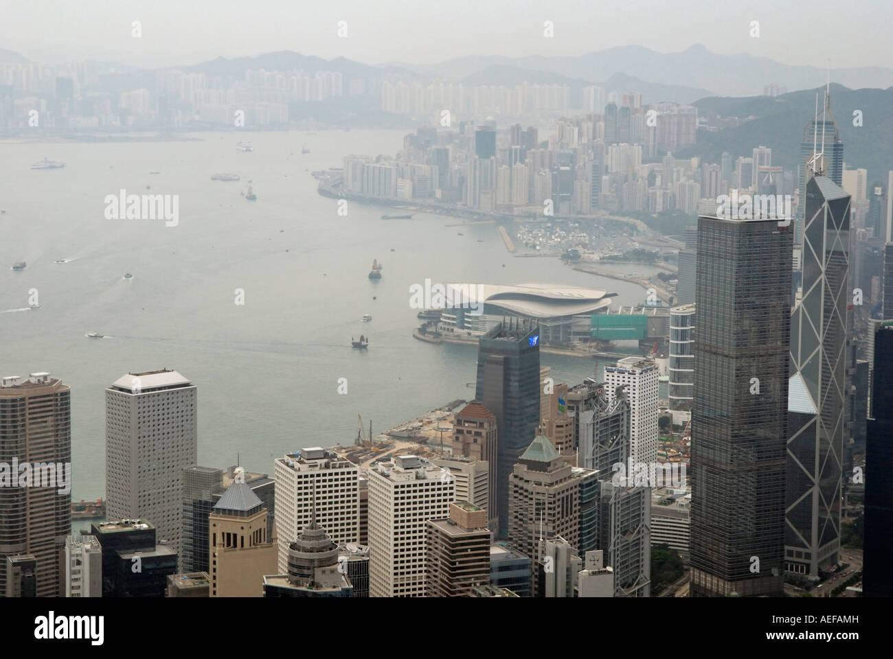 Hong Kong the harbour and Kowloon from 400 meter meters high. The view is often very bad due to the pollution. Stock Photo