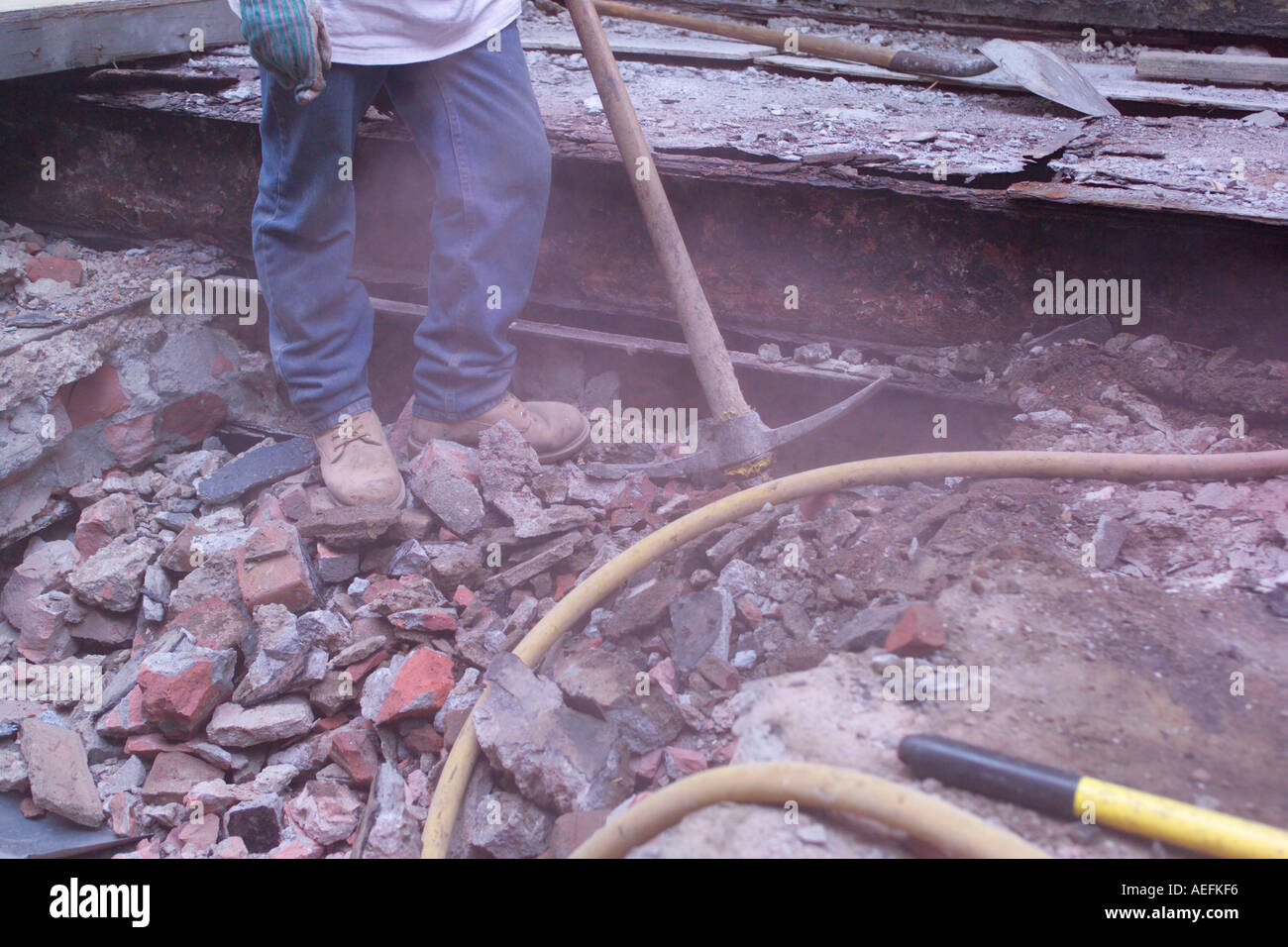 Breaking concrete with pick axe Stock Photo Alamy