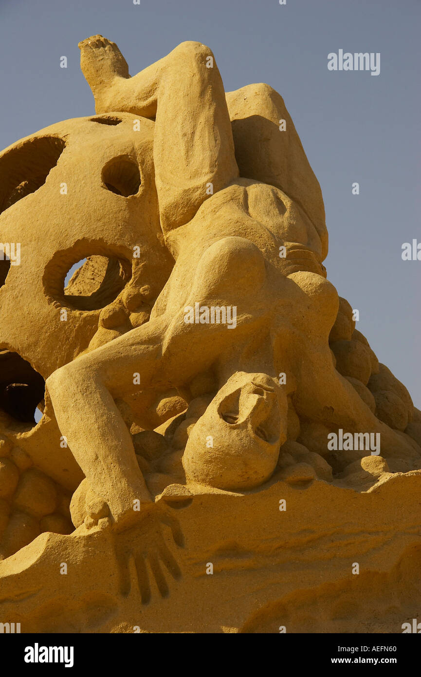 sand sculpture of falling woman Stock Photo Alamy