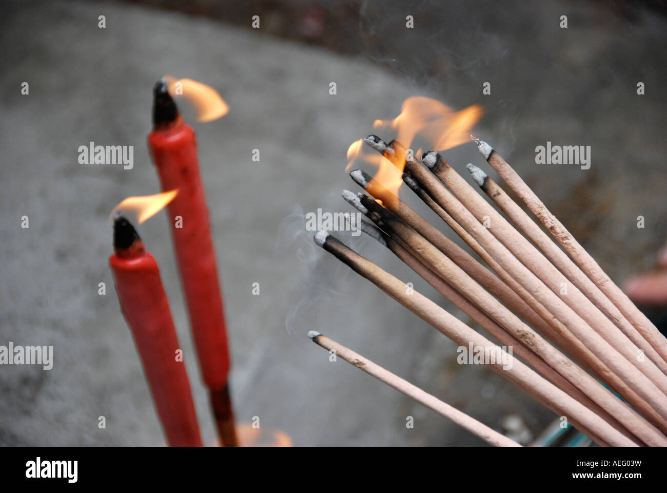 Lighting Candles and Burning Incense at a grave as a sign of respect at