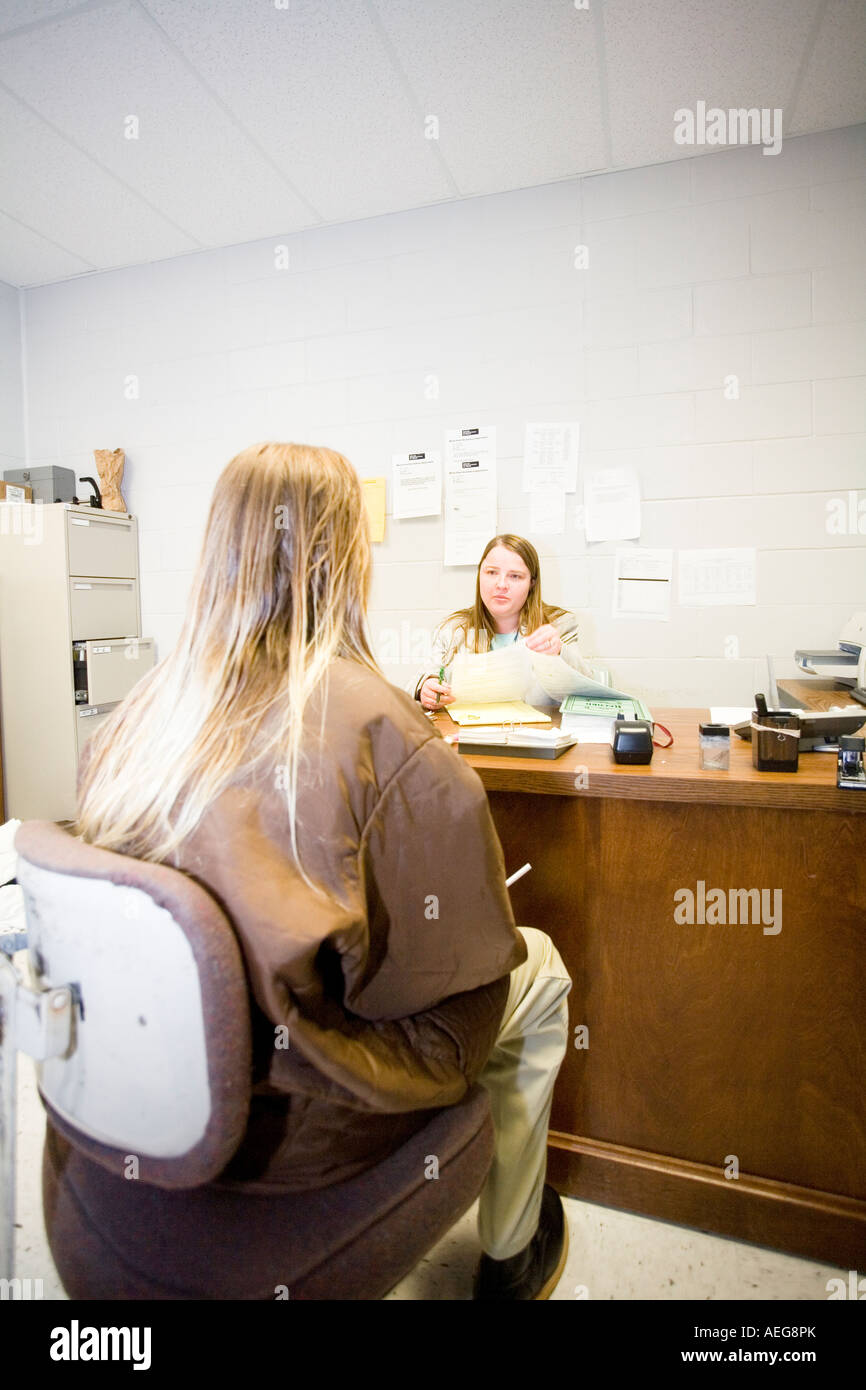 Female inmate talking to psychologist in the Nebraska Correctional Center for Women in York Nebraska USA Stock Photo