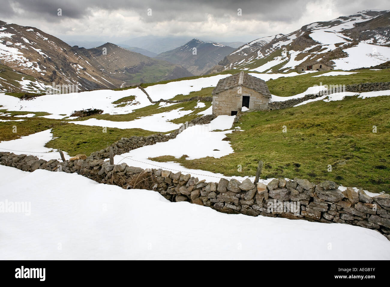 landscape snow covered with cabins in lel port of stakes of trueba fertile valley of pas cantabria Spain Stock Photo