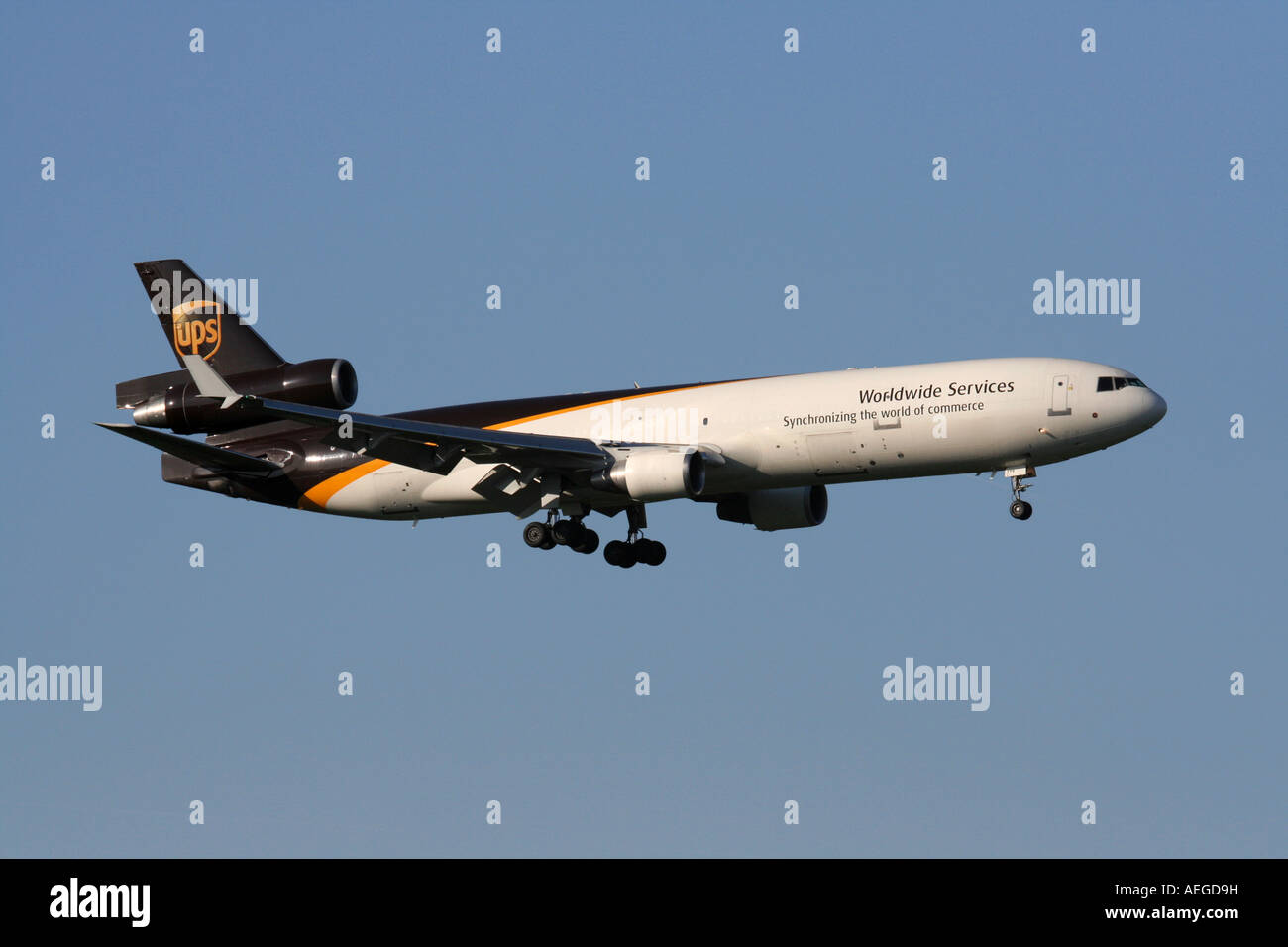 Business logistics. McDonnell Douglas MD-11F freighter operated by United Parcel Service. Air freight delivery and international trade. Stock Photo
