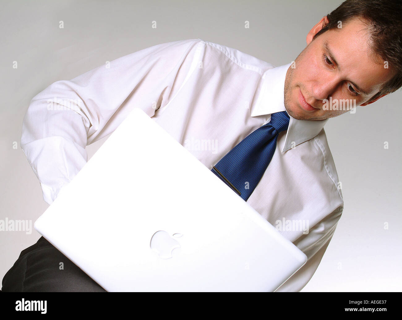 businessman tie shirt sitting laptop typing looking screen business concept people male person man Stock Photo
