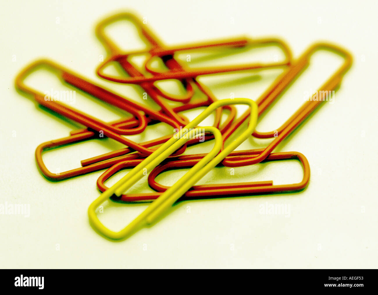 Office paperclips paperclip metallic few contrasty yellow red Stock Photo