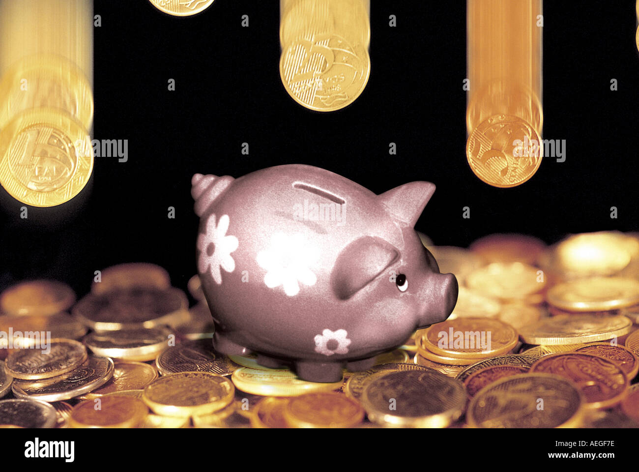 Office piggy bank savings coins falling money currency coin senses miscellaneous background texture Stock Photo