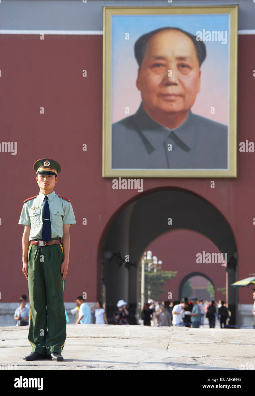 Guard standing in front of Gate of Heavenly Peace and portrait of Chairman Mao, Beijing China. Stock Photo