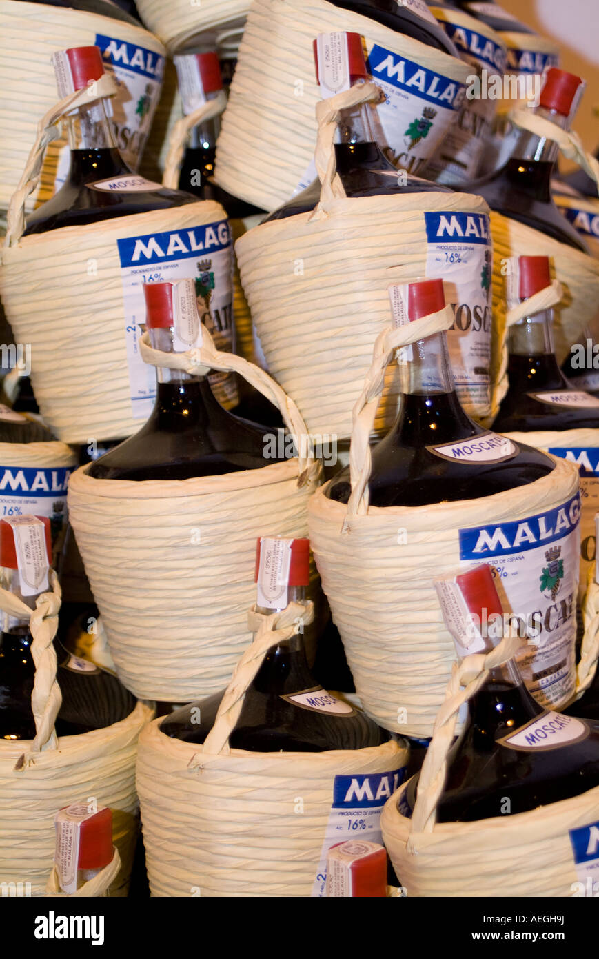 Malaga Dulce, Malaga Sweet Wine, bottles in typical baskets Stock Photo