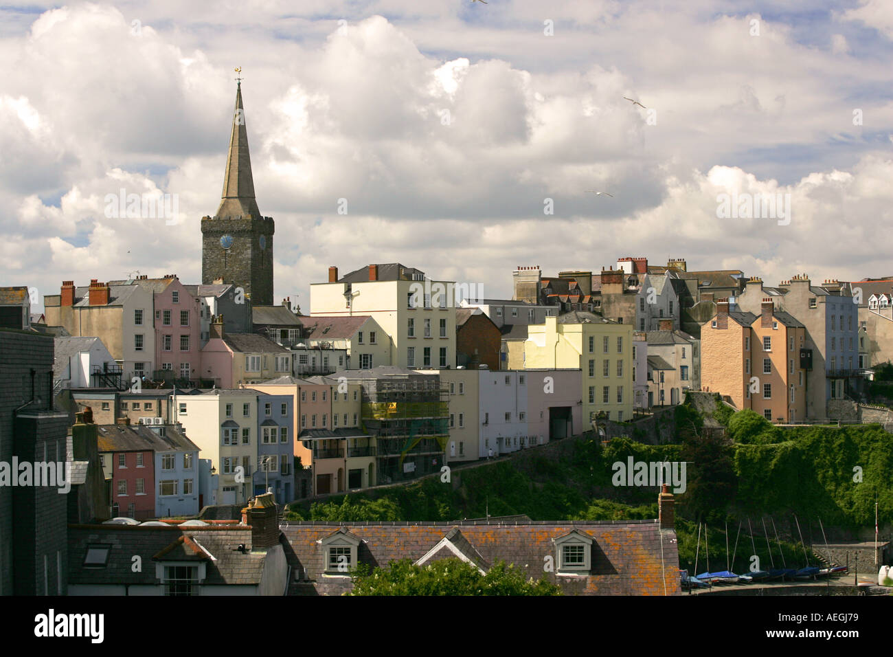 The spire of St Marys Church Tenby dominates the colourful skyline of