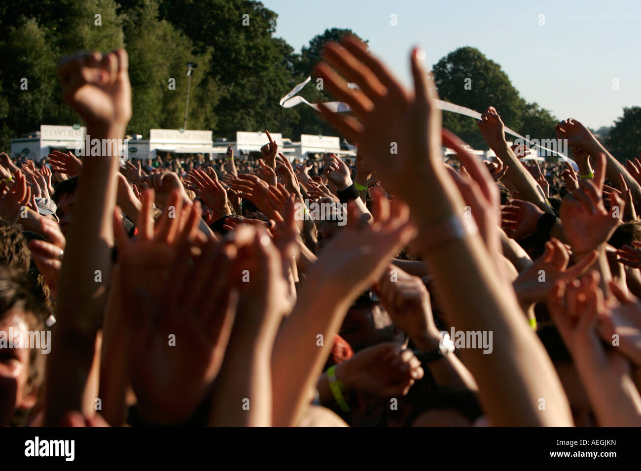 fans at an open air summer festival concert waving their arms in the air sea of hands belfast Stock Photo