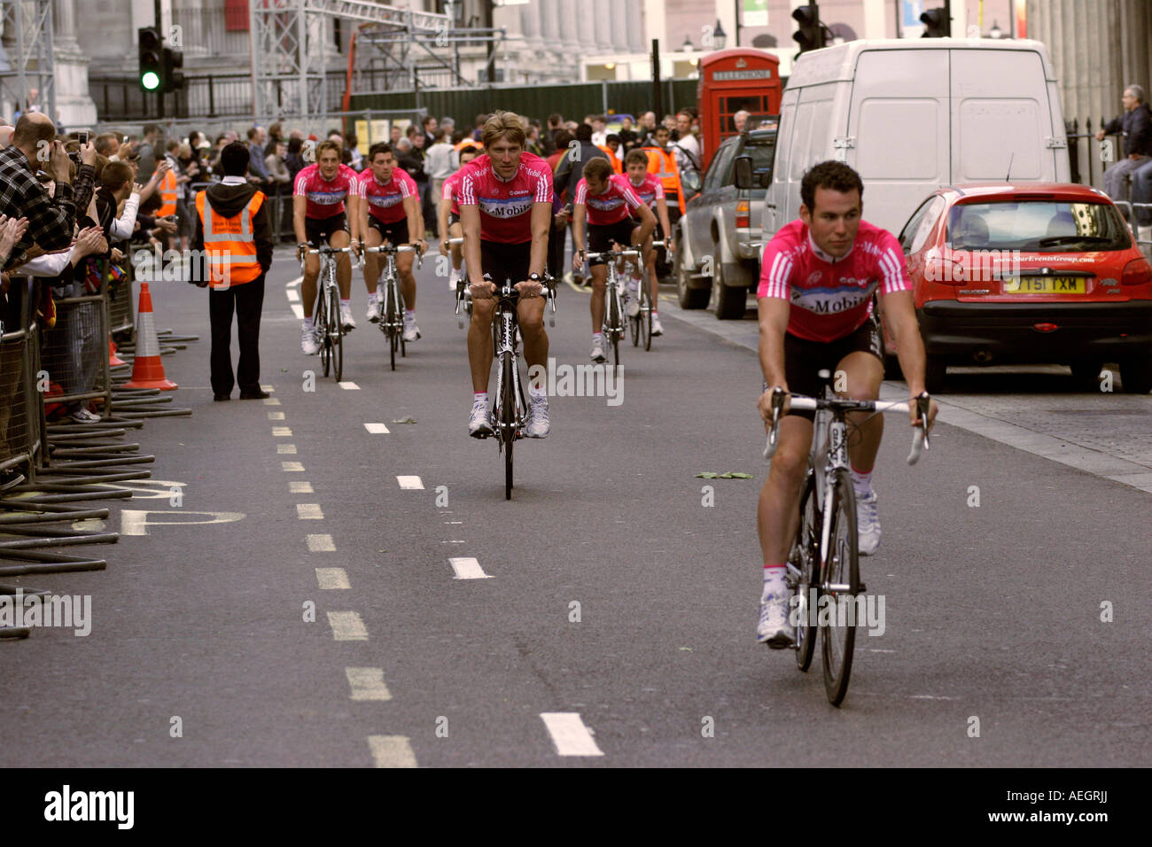 The T Mobile Tour De France team leave Trafalgar Square at the Grand Depart in London and pass spectators Stock Photo
