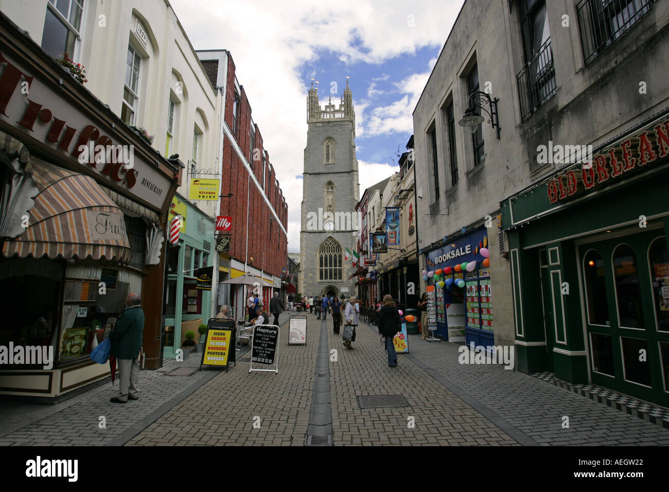 Tourists walk down a cobbled shopping street in Cardiff city centre near the Millennium sports stadium Wales UK Britain Stock Photo