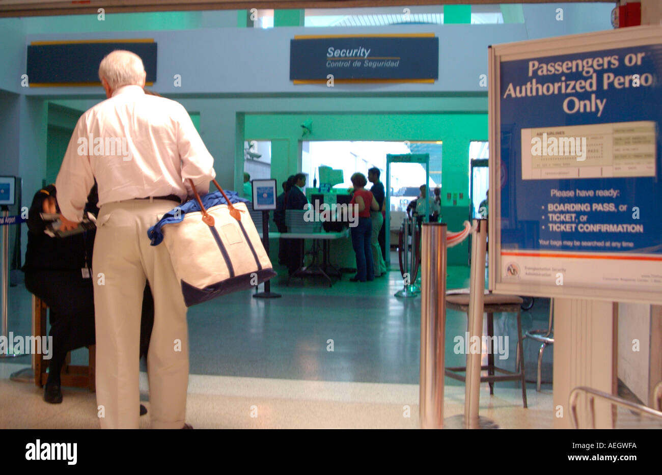 Senior passenger going through airport security Stock Photo Alamy