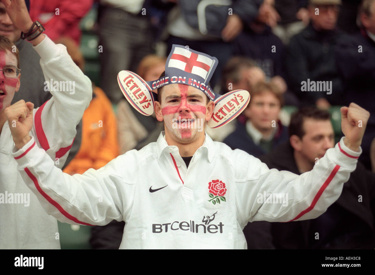 Young man England rugby union fan cheering the team at Twickenham Stadium London England UK Stock Photo