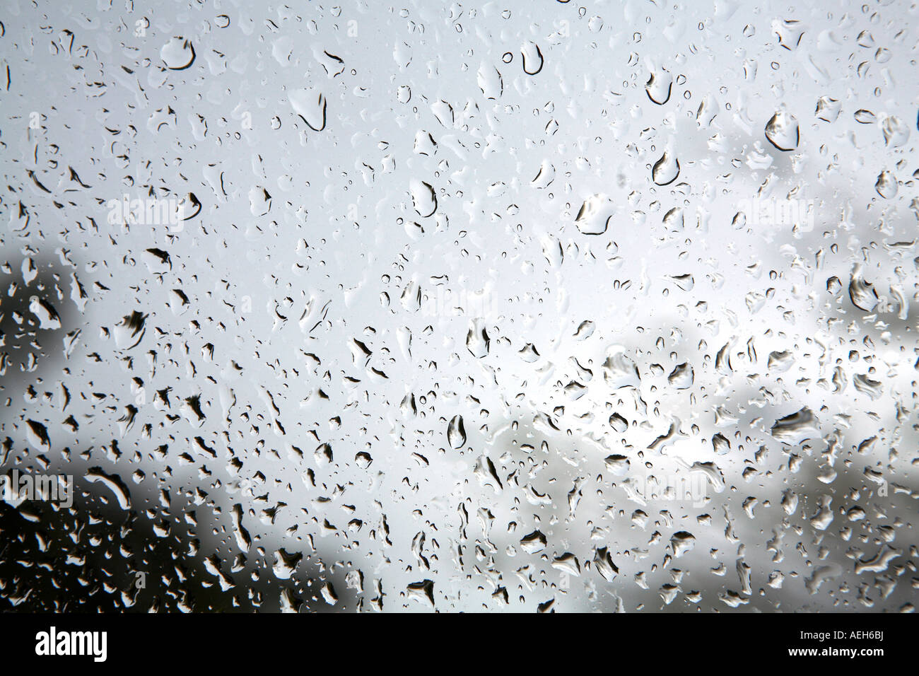 Water drops rain on windshield wet abstract design texture pattern background shadow Stock Photo