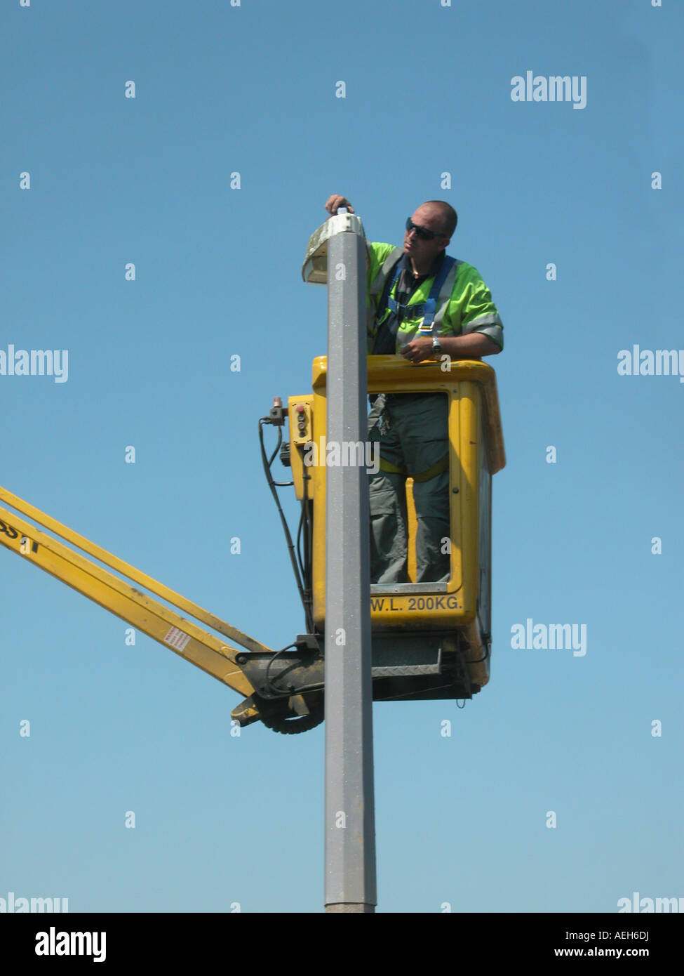 street lighting contractor vehicle in use with workman changing