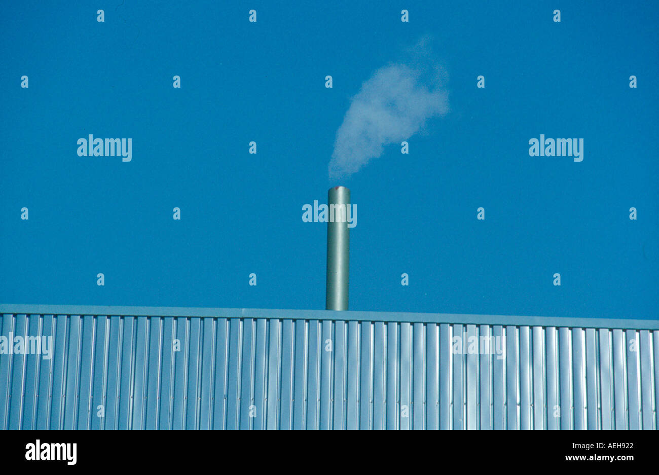 factory chimney with smoke. Photo by Willy Matheisl Stock Photo