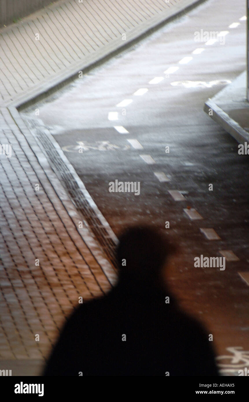 Street with shadow of a man Stock Photo - Alamy