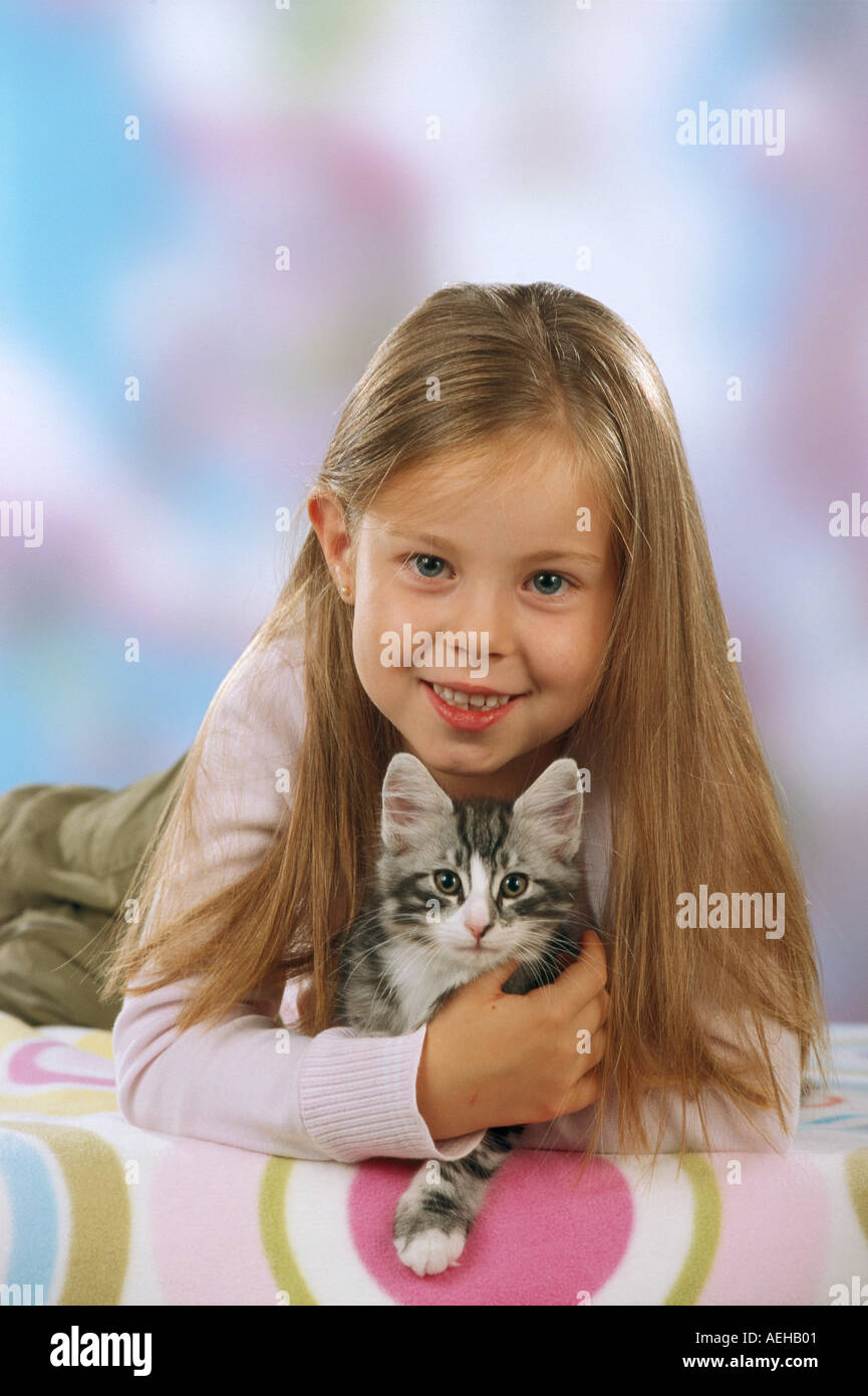 girl with young norwegian cat kitten Stock Photo