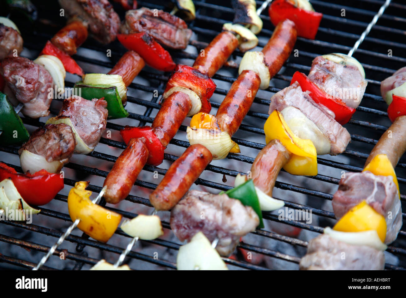 Barbecue grill filled with meat, bell peppers and onion Stock Photo Alamy
