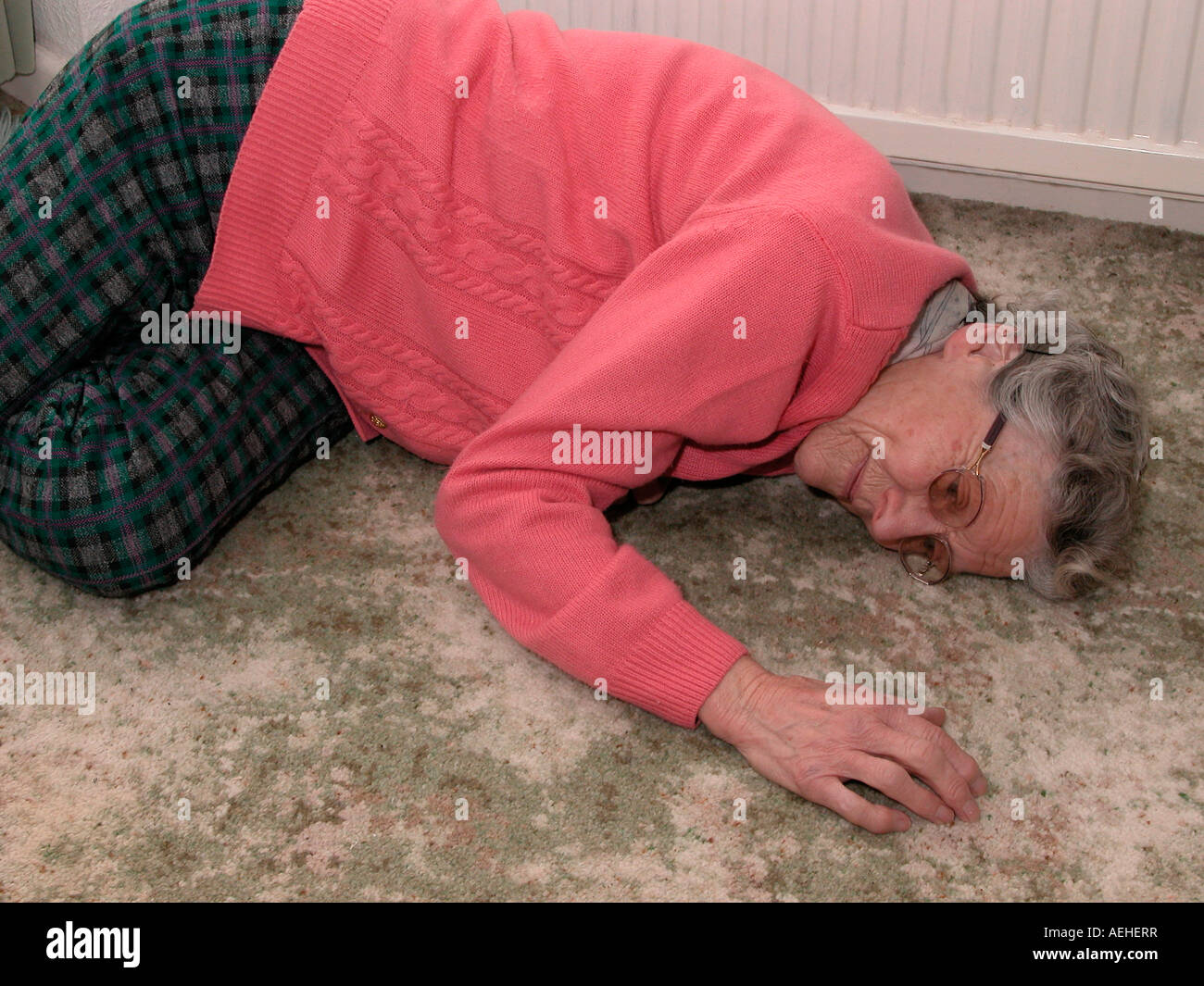 elderly woman fallen over or collapsed on floor Stock Photo Alamy