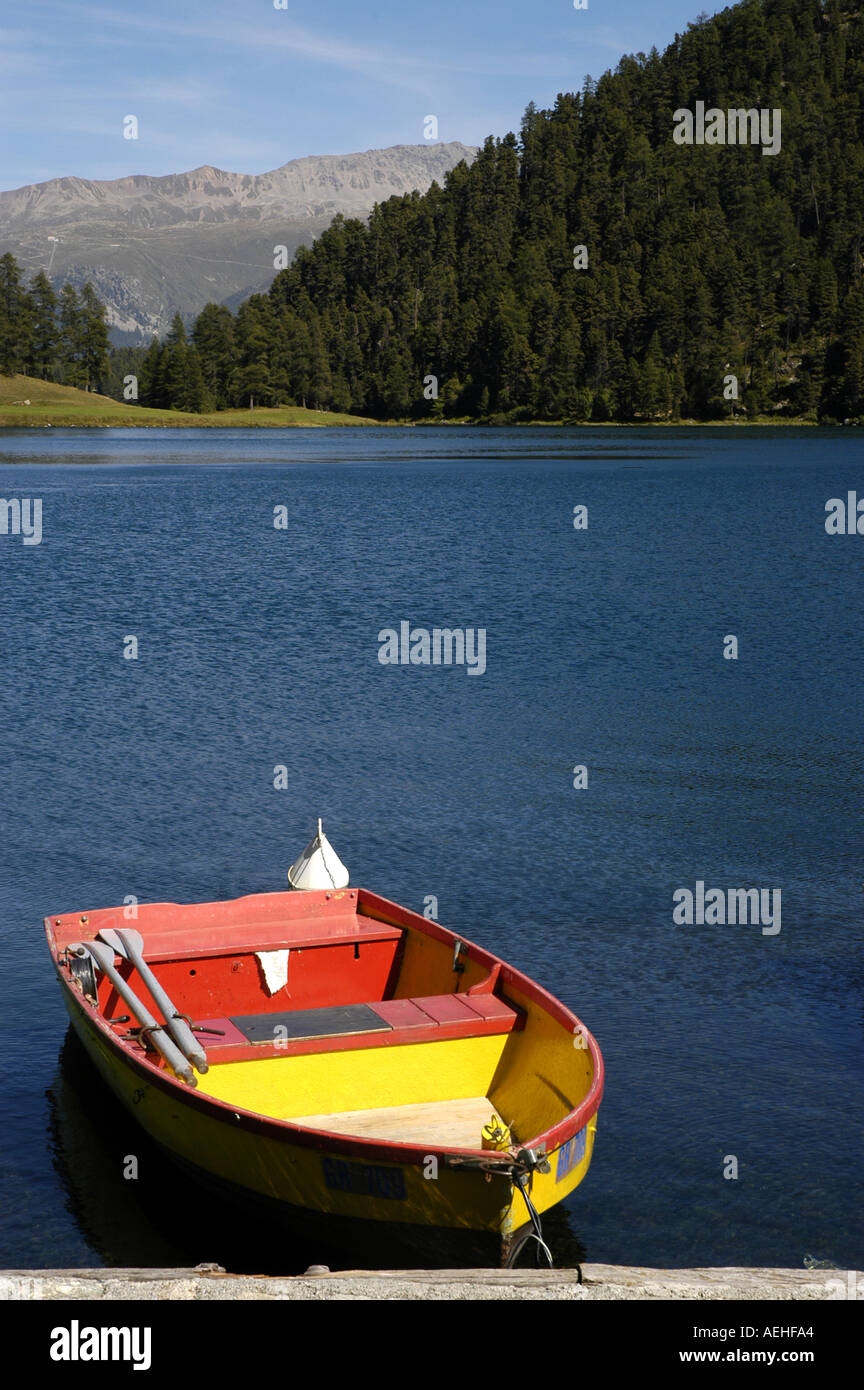 Switzerland Alpine Lake near St Moritz colorful fishing boat Stock Photo