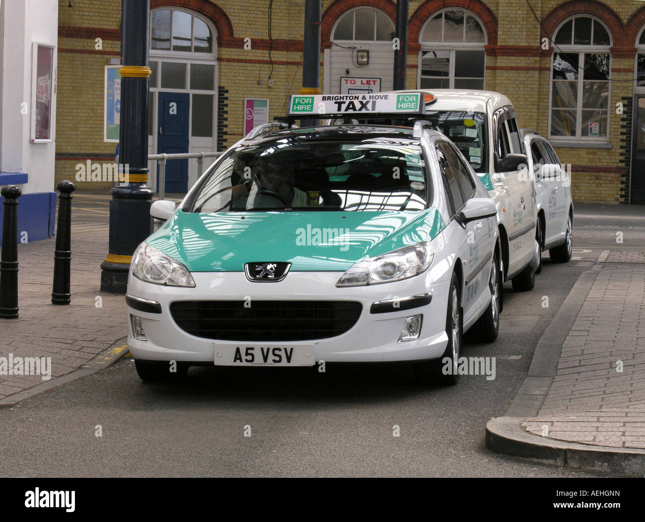 taxis outside Brighton Station East Sussex waiting for passengers Stock