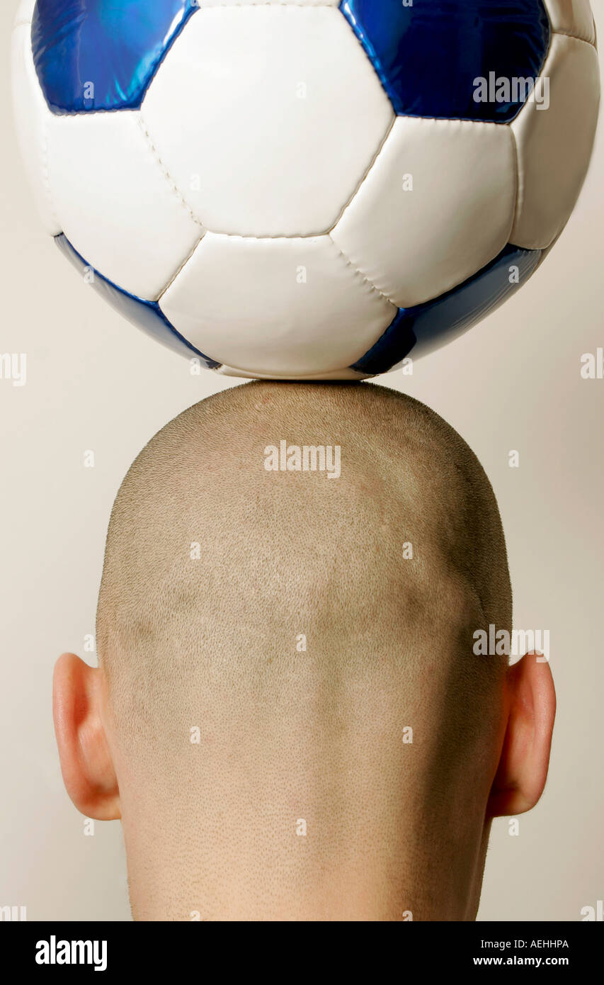 Man with soccer ball on head, rear view, closeup Stock Photo Alamy