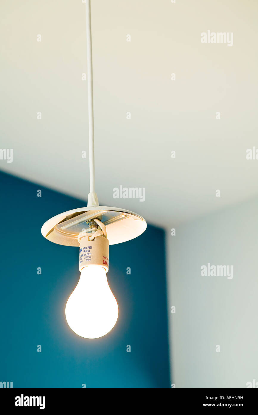 Light Bulb Hanging From White Cord Stock Photo Alamy