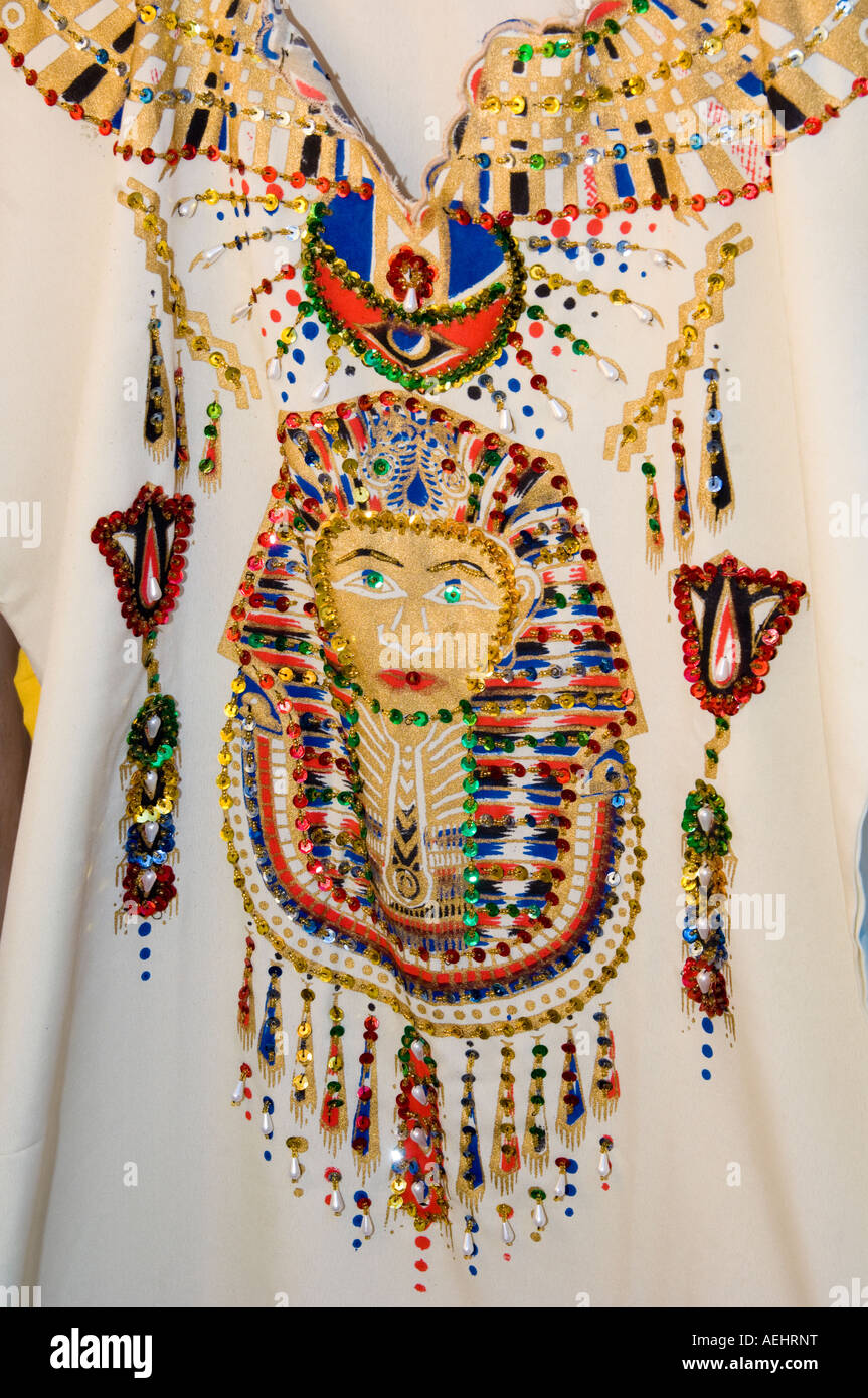 Ladies garment with ancient Egyptian design embroidered on it Stock