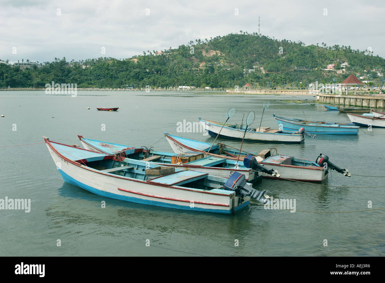Some fishing boats in Samana Dominican Republic tied to the coast Stock Photo