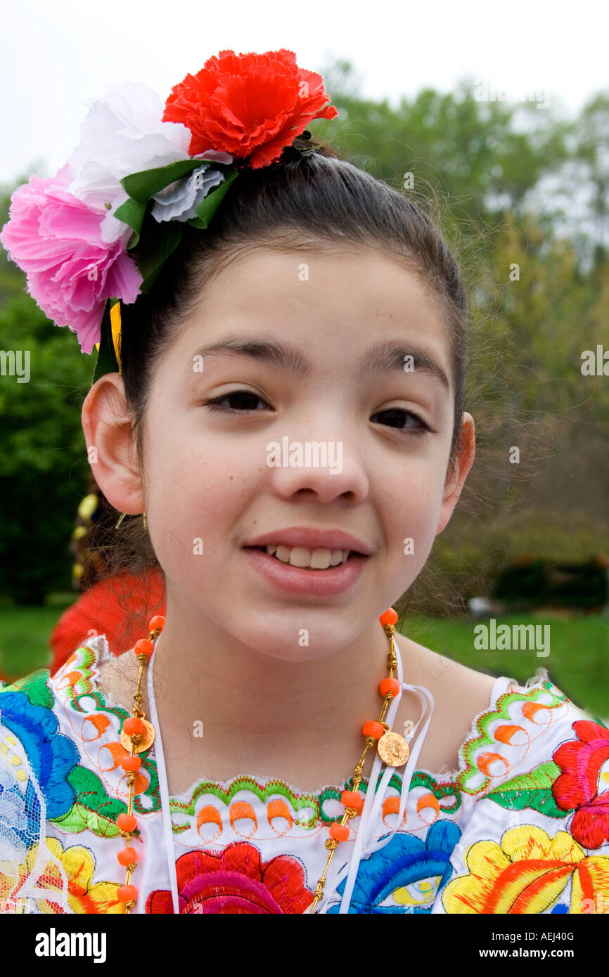 Chicana girl age 11 wearing Mexican dress in parade. Cinco de Mayo Fiesta. "St Paul" Minnesota USA Stock Photo