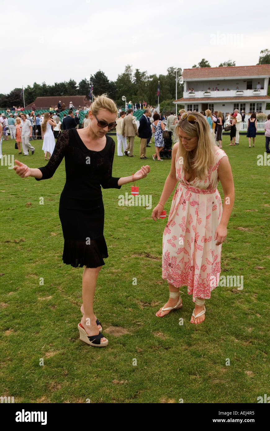 Treading in divots Guards Polo Club Windsor Great Park. Cartier International Polo match Egham, Surrey England  2000s 2006 HOMER SYKES Stock Photo