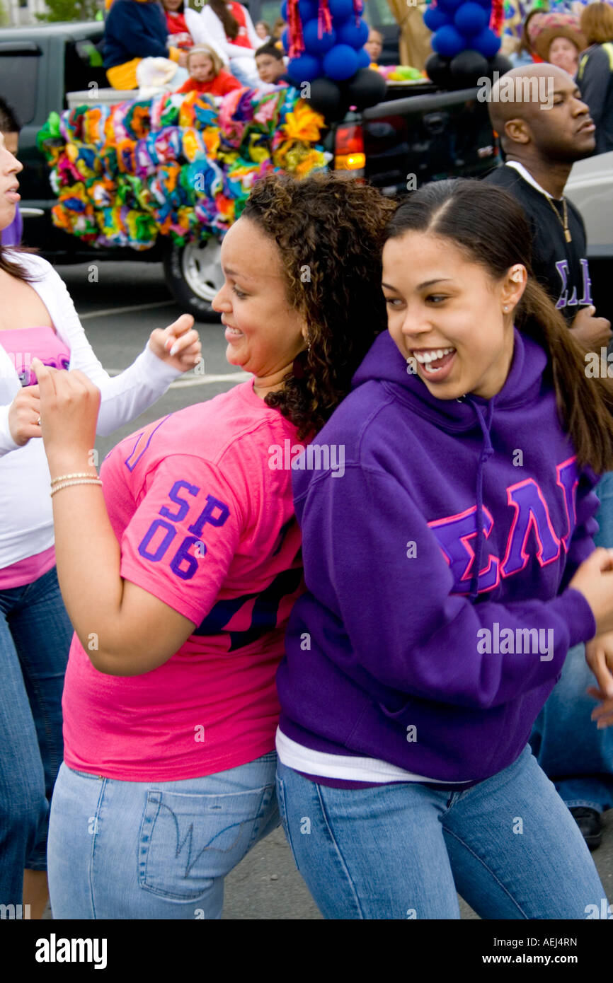 Latina sorority sisters of Sigma Lambda Gamma dancing before parade started. Cinco de Mayo Fiesta. 'St Paul' Minnesota USA Stock Photo