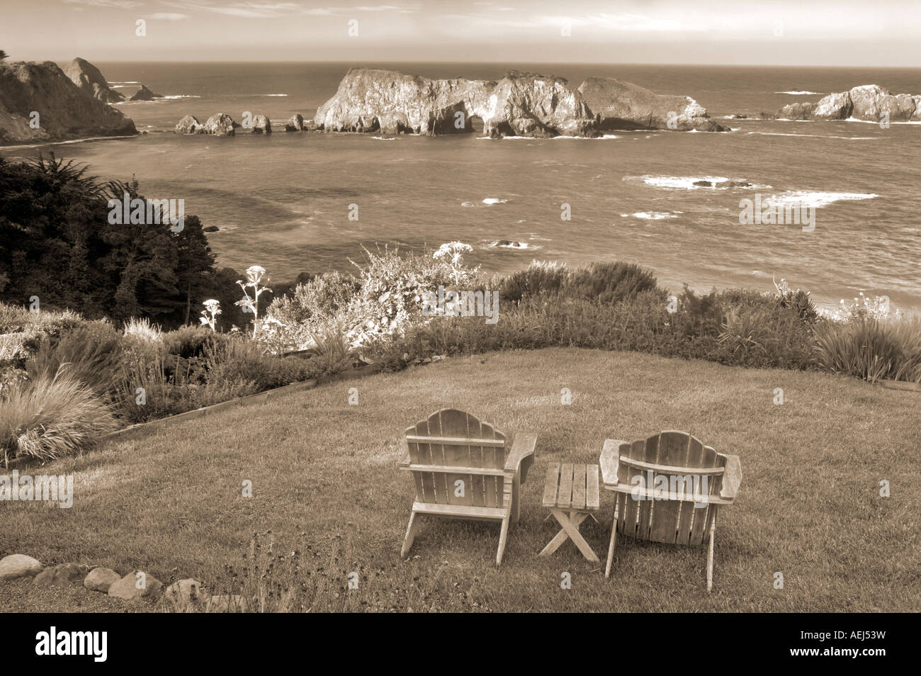 Two chairs on grass overlook at The Harbor House Inn Elk California Stock Photo