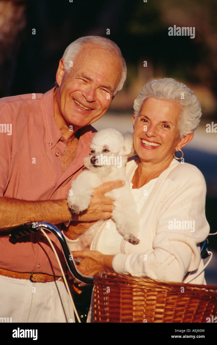 Mature couple with dog portrait Stock Photo - Alamy