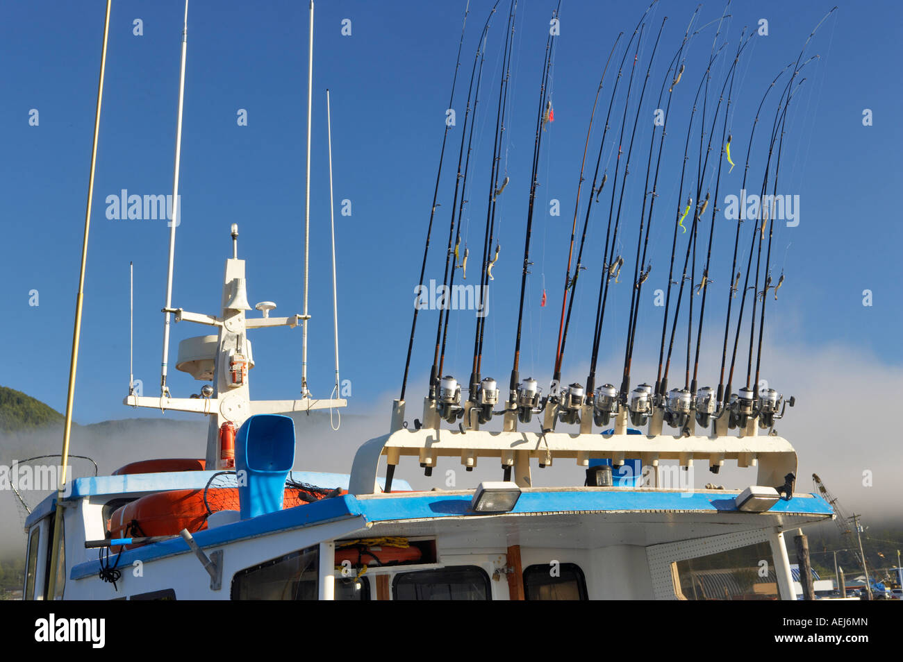 Fishing poles on sport fishing boat Garibaldi boat harbor Oregon Stock