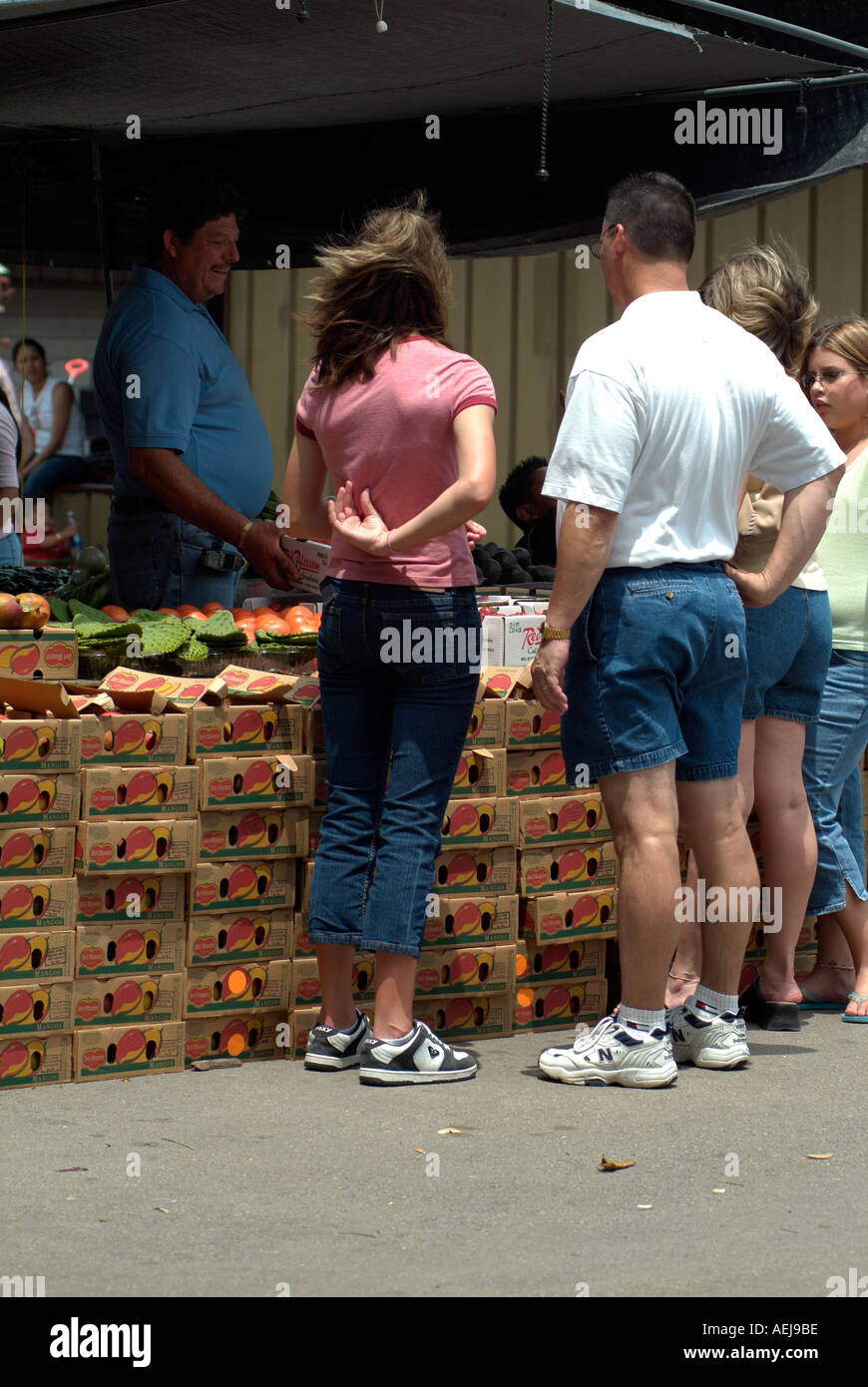 People choosing and buying fruits Stock Photo